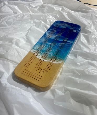 beautiful pearlescent ocean colours and unique one of a kind resin cribbage boards. photo realism