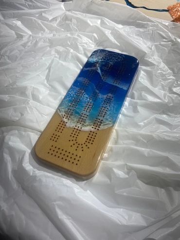 beautiful pearlescent ocean colours and unique one of a kind resin cribbage boards. photo realism