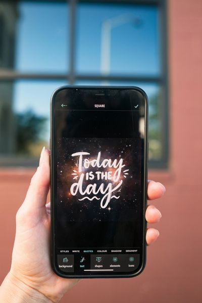 Woman's hand holding cell phone by Typerium App on Unsplash