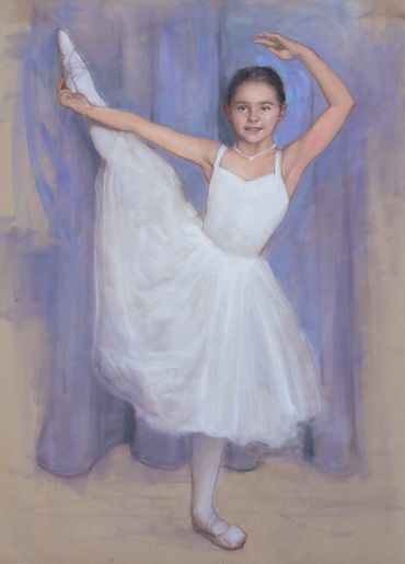 Young ballerina in white tutu gracefully lifting her leg in a dance pose.