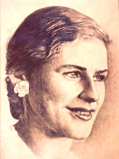 Detailed pencil portrait of a smiling woman with a flower in her hair.