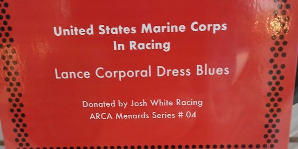 Plaque at the exhibit showcasing the United States Marine Corps in Racing