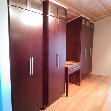 A set of custom built-in closets and desk area