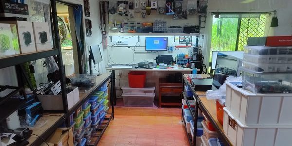 Living room converted into computer repair studio.