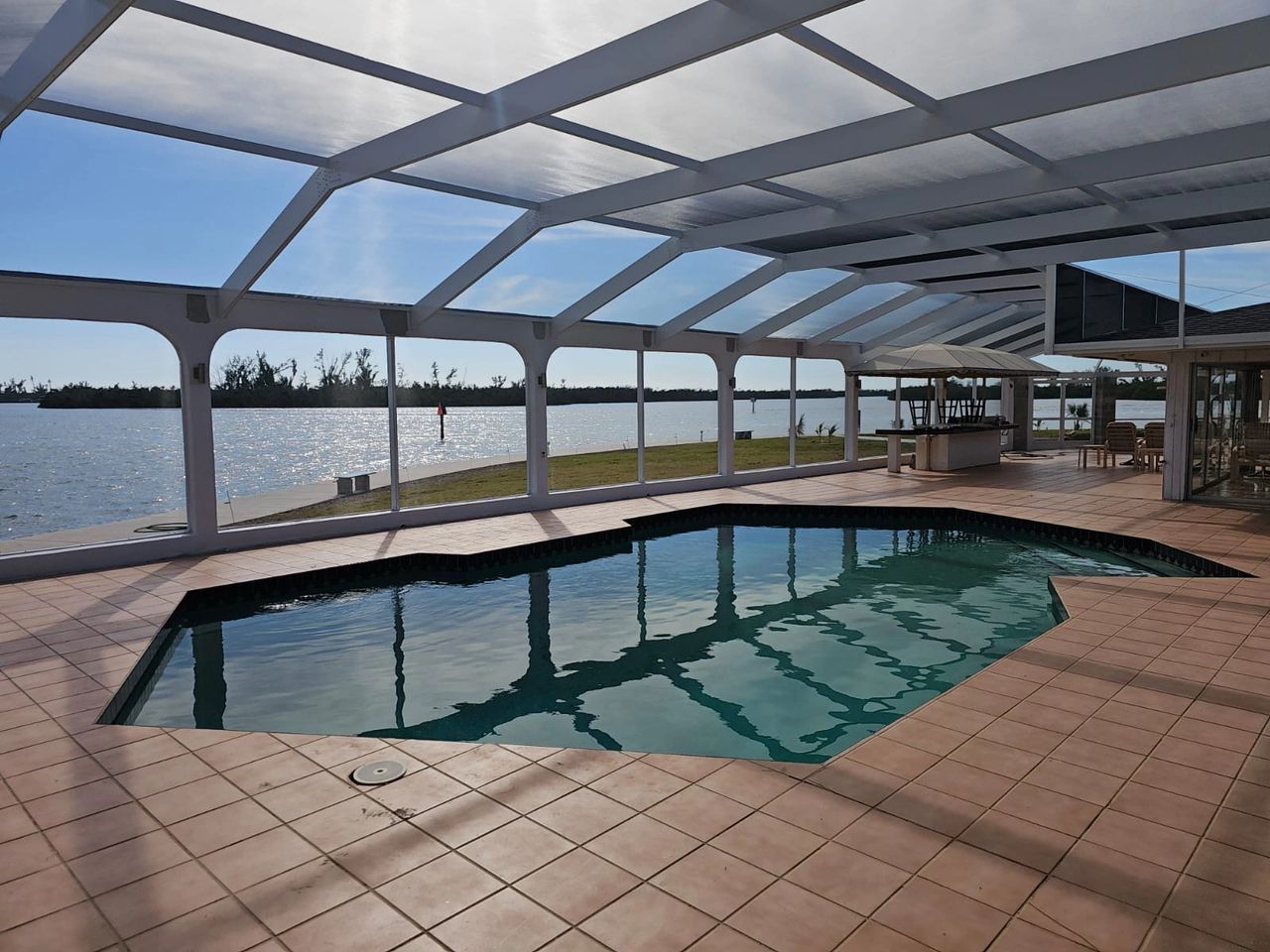 Enhance your outdoor space with our Pool Cage Painting, Rescreening, and Restoration services.