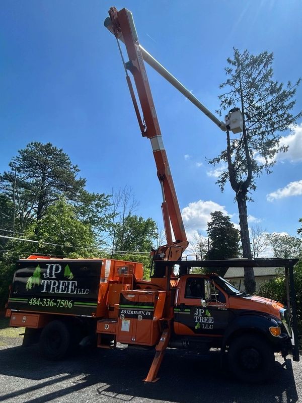 JP TREE LLC bucket truck performing controlled tree removal in Boyertown, PA