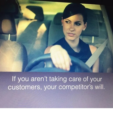 Woman driving a car relaxed pondering