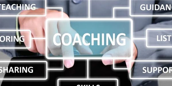 Person interacts with a digital interface highlighting coaching and related skills.