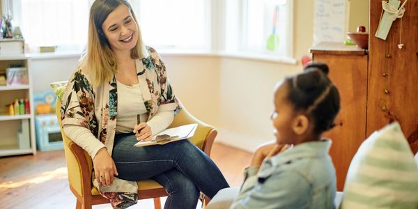 A FBI-aba agent working with a child in a in-home setting