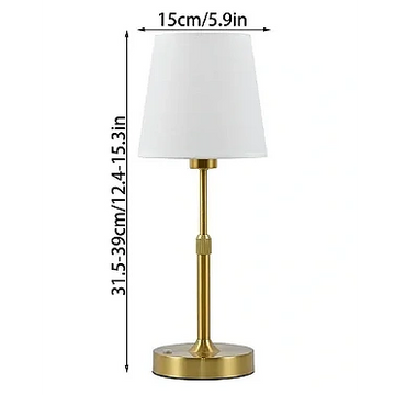 Brass table lamp with white shade, 31.5-39 cm tall, 15 cm shade diameter.