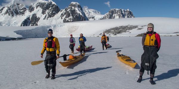 Sea kayaking over sea ice in Antarctica
