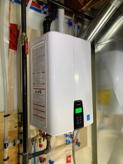 Navien tankless water heater installed by Signature Plumbing & Heating in Regina for hot water.