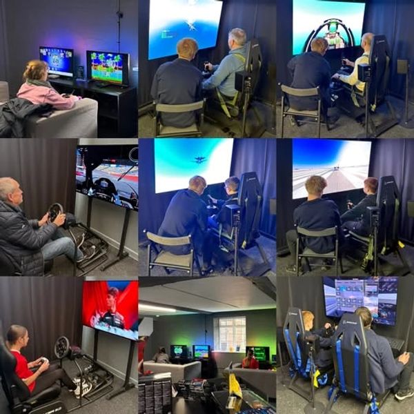 People engaged in various video game simulations and racing setups in a gaming room.