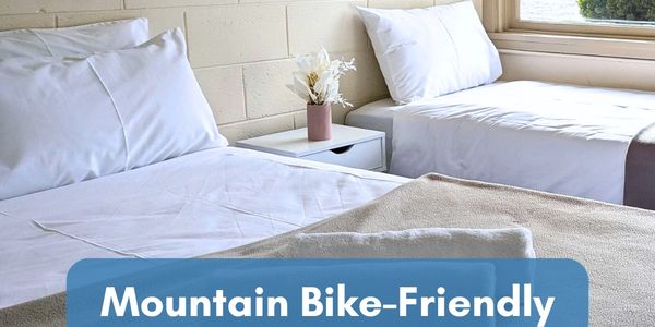 Cozy twin beds in Swiss Motel Cooma, perfect for mountain bikers.