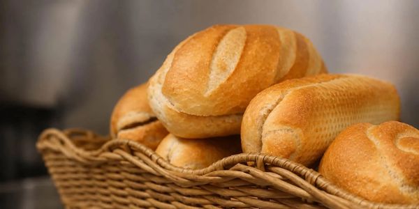 Basket filled with freshly baked bread rolls.