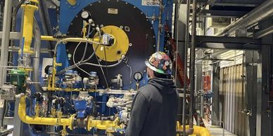 PCS engineer walking down a boiler during a scheduled service visit