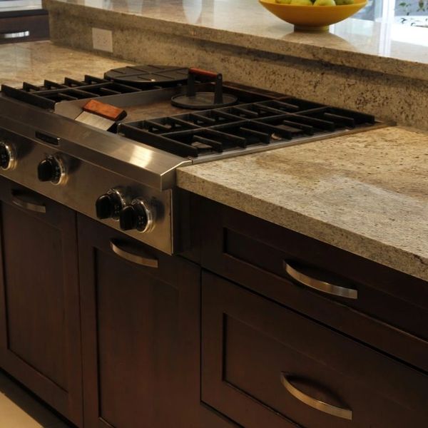 Range With Dark Shaker Cabinets and Granite Countertops