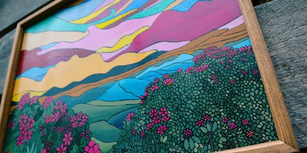 Vibrant skies over a floral mountainside 