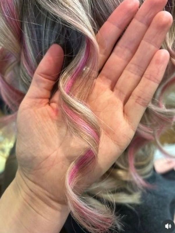 Pink and blond curly hair colour by Ciscos Karma Hair salon Brighton