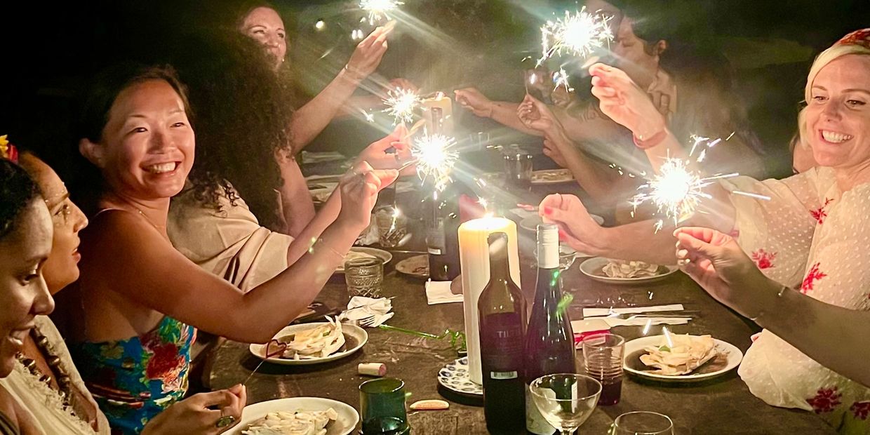 Group of people
Smiling and eating and toasting 