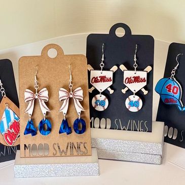 Earrings featuring Ole Miss and baseball themes in blue and red colors.