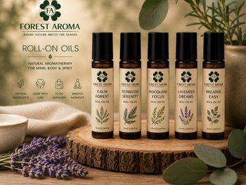 Five roll-on aromatherapy oils by Forest Aroma displayed on a wooden slab.