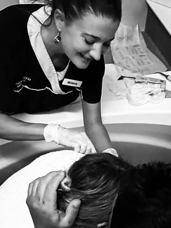 Midwife facilitating a waterbirth