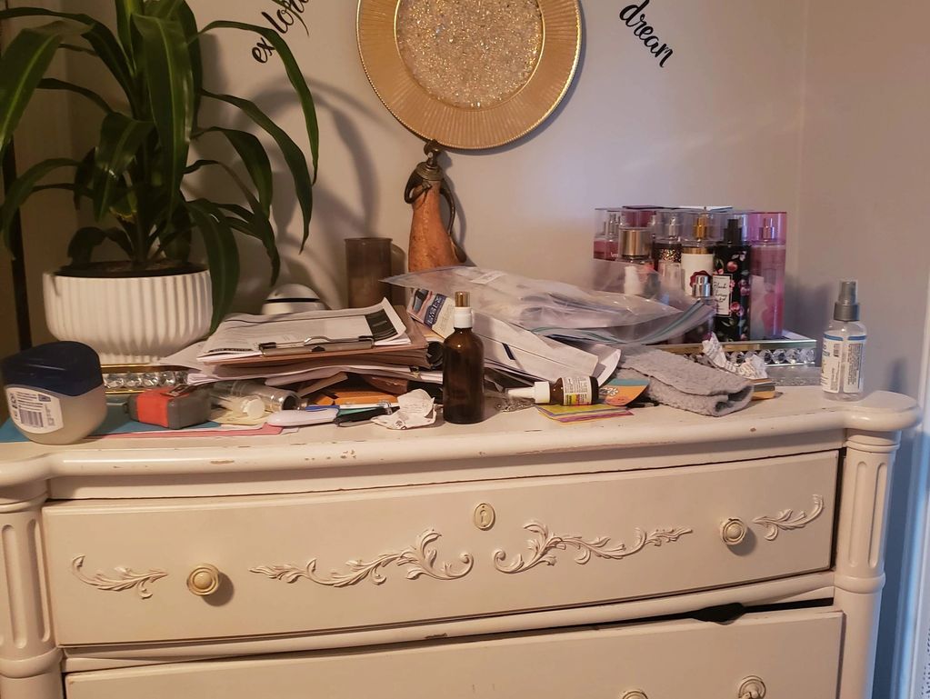 bedroom before decluttering showing visual and storage overwhelm
