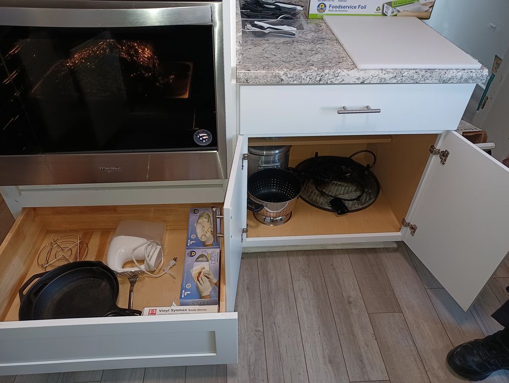 after kitchen organization showing clean counters and efficient storage systems