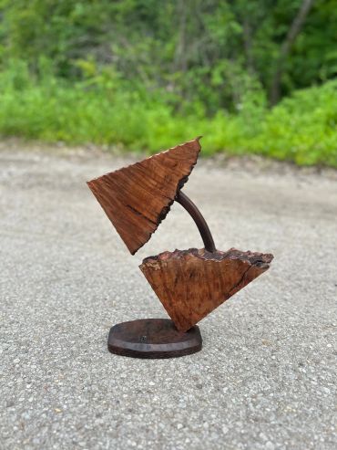 Abstract wooden sculpture with geometric shapes.
