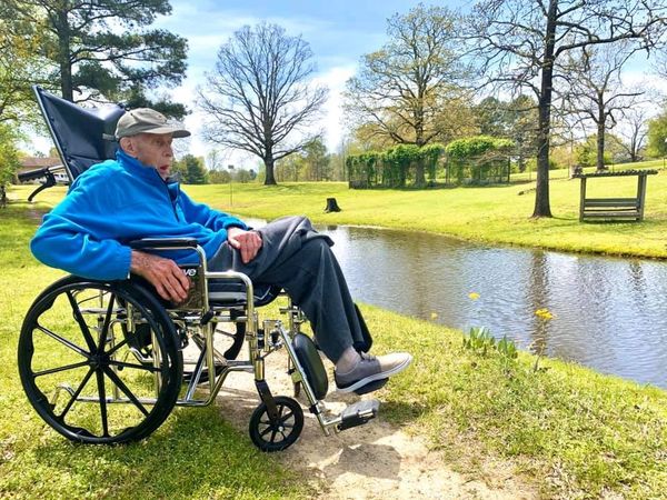 seniors and outdoors, elderly gentleman getting a view of pond and ducks