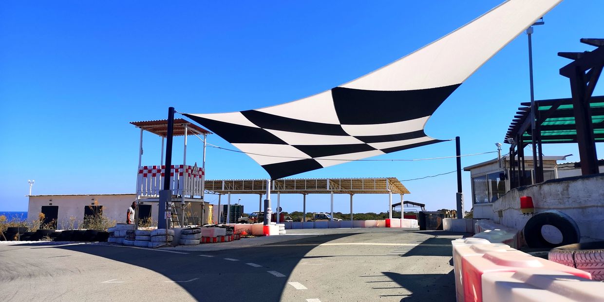 Customised shade sail installed at the race track in Akrotiri, Cyprus, by Shadeports Plus Ltd.