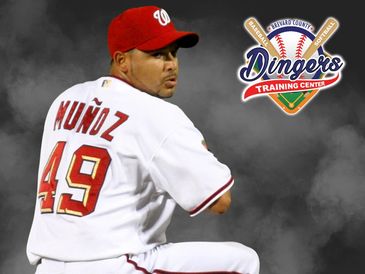 Baseball player Munoz in pitching stance wearing jersey number 49.