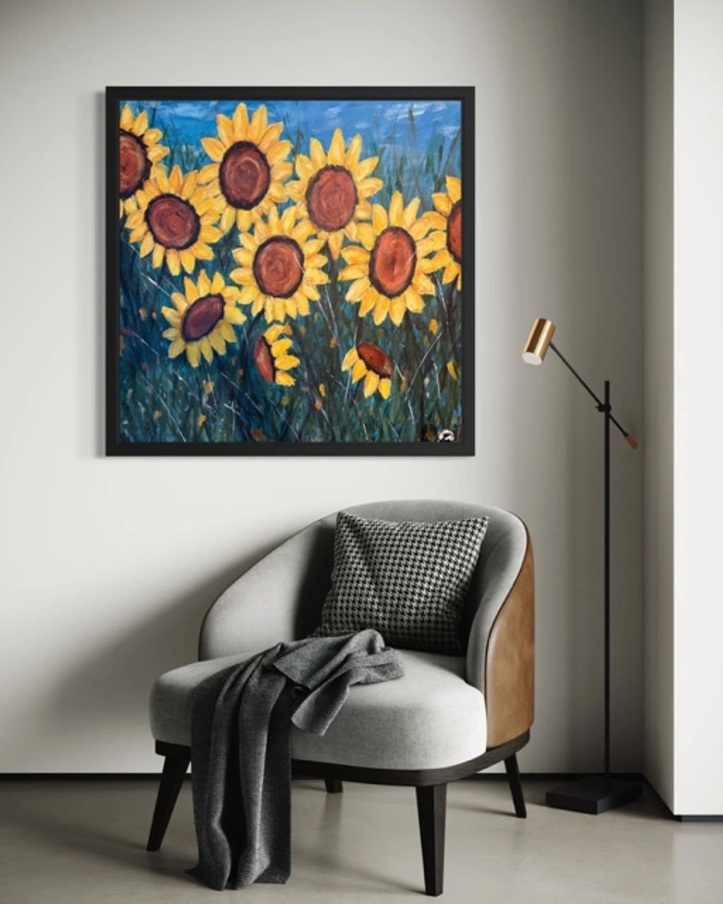 Cozy chair with sunflower painting and floor lamp.