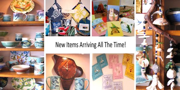 Display of colorful handmade crafts and pottery with new arrivals announcement.