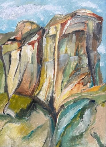 Abstract painting of rocky cliffs with earthy tones under a blue sky.