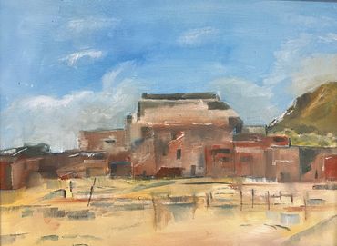 Painting of a rustic adobe village under a blue sky.