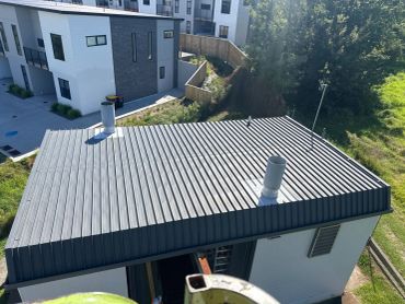 View of a corrugated metal rooftop on a building.