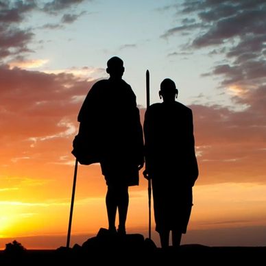 Maassai warriors looking out over an African sunset