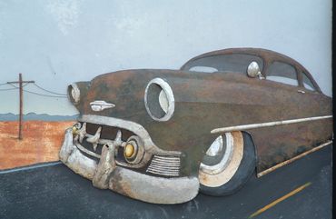 original metal art vintage 53 chevy car on desert road