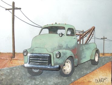 original metal art vintage tow truck in the desert