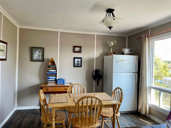 Bright and spacious dining area complete with historic local muskie decor.