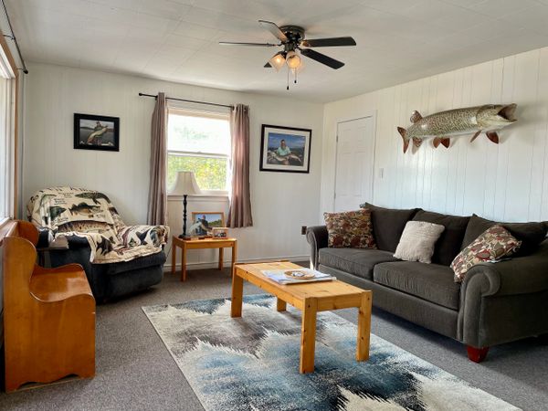 Musky decor in the living room includes pics of 55"+ muskies caught by VFGS clients and a 57" mount!!