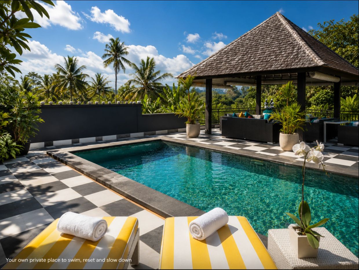 Tropical private pool with lounge chairs and gazebo.