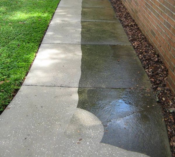 Picture of a sidewalk being pressure washed
