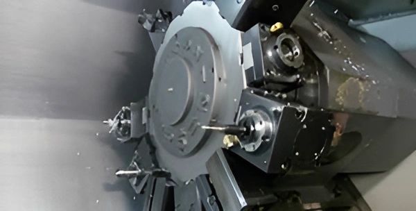 A close-up of a large industrial machine, possibly a CNC lathe or milling machine.