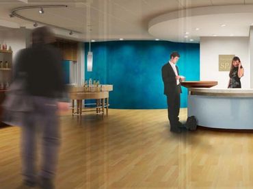 photo of medical spa reception interior maple floor curved white desk turquoise wall retail area