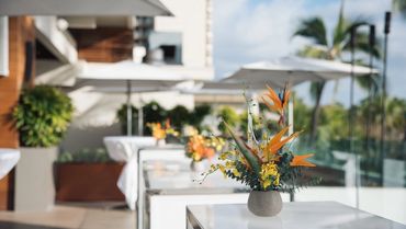 mood photo of dining and table setting by Jule Lucero Interior Design bird of paradise in vase