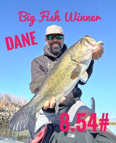 Man named Dane holding a large fish weighing 8.54 pounds.