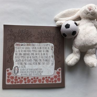 A sentimental art print with a stuffed bunny and soccer ball.